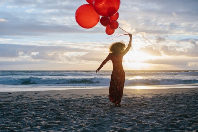 Woman holding baloons