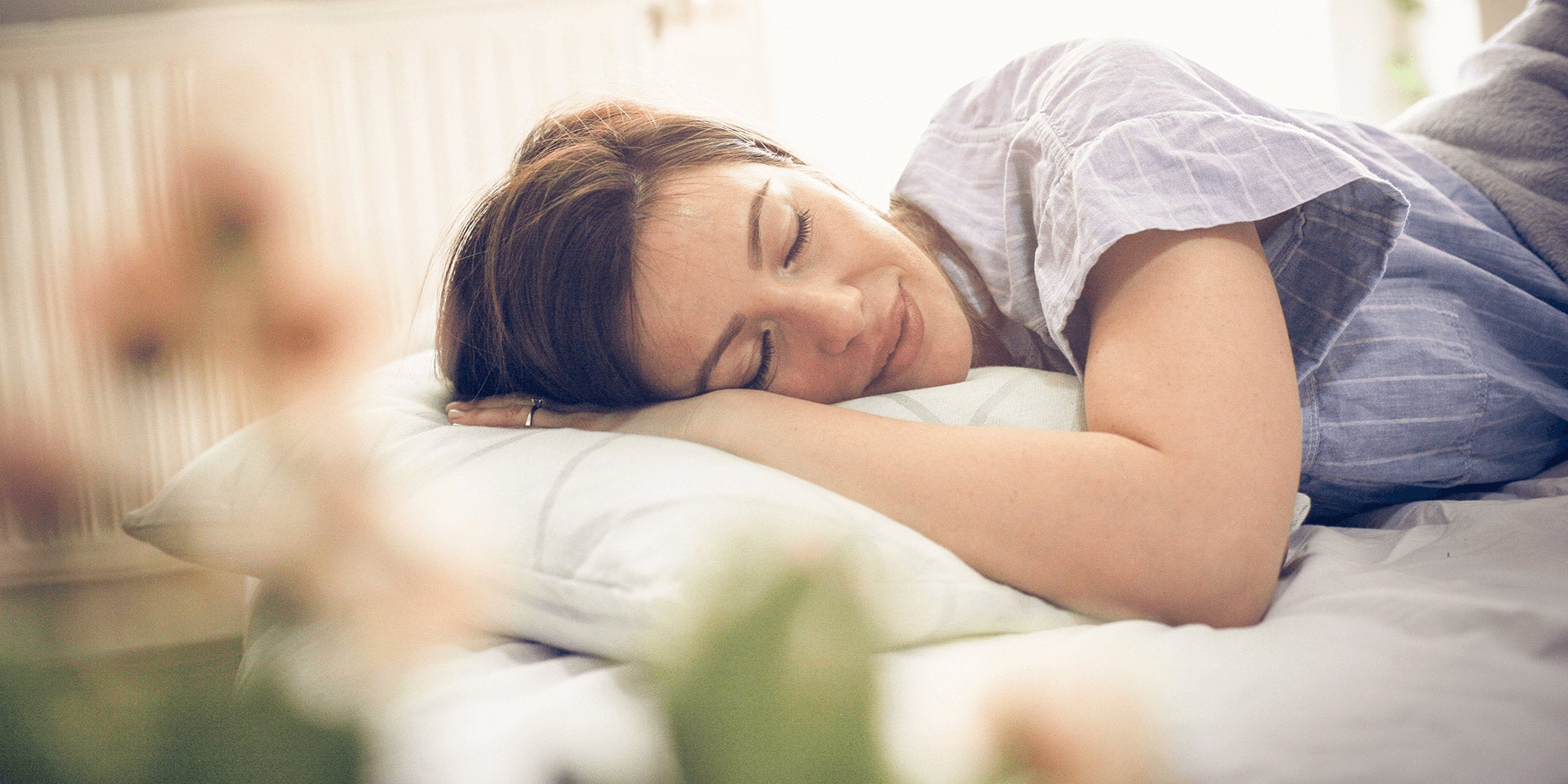 Lady resting her head on pillow