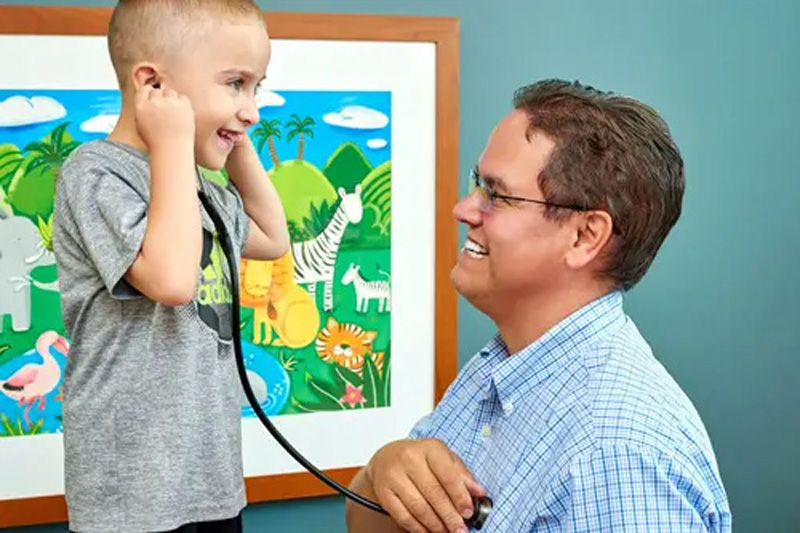 Physician with child patient