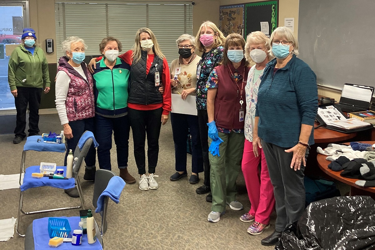 This amazing group of dedicated volunteers demonstrate remarkable teamwork when caring for the feet of those experiencing homelessness.